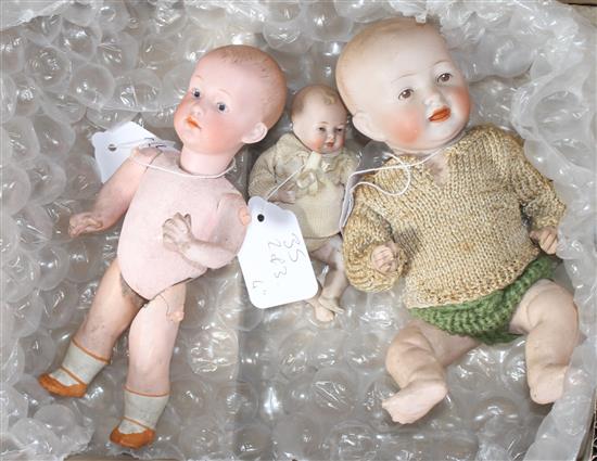 A Heubach character doll, intaglio eyes, 8in., a German all bisque baby, 4in. and a German character baby, composition body, 9in. (3)